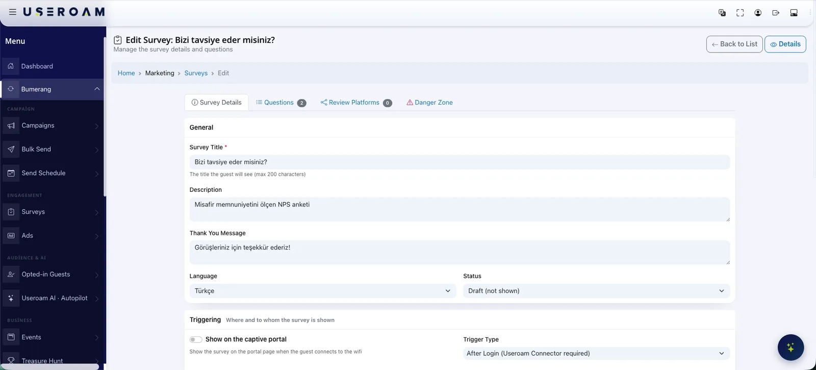 Useroam survey editor: the NPS survey title, description and thank-you text; language and status selectors; and the trigger setting that decides whether the survey appears on the captive portal or after login